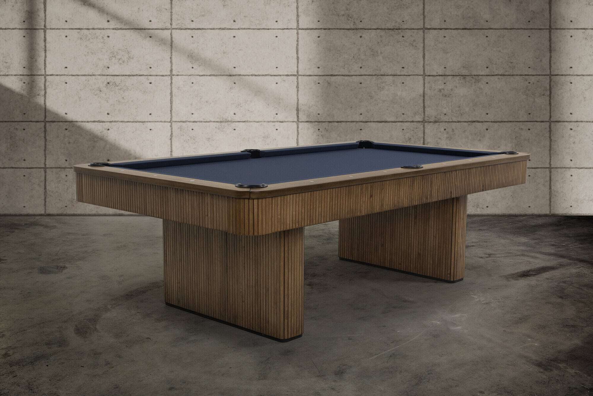 The Slater pool table by Doc & Holliday featuring a reeded, slat-style wood cabinet and architectural base, designed as furniture for modern interiors.